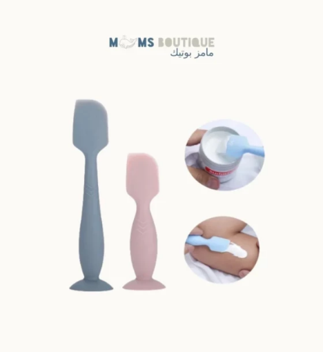 صورة أداة توزيع كريم طفح الحفاض على الجلد